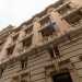 Superiamo una palazzina rosa che ospitava, fino a poco fa, degli uffici comunali 